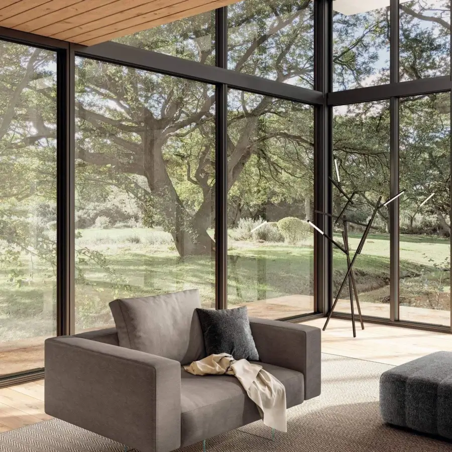 Superior Lago Air lounge chair with matte medium gray textile upholstery, sleek lines and tempered glass legs