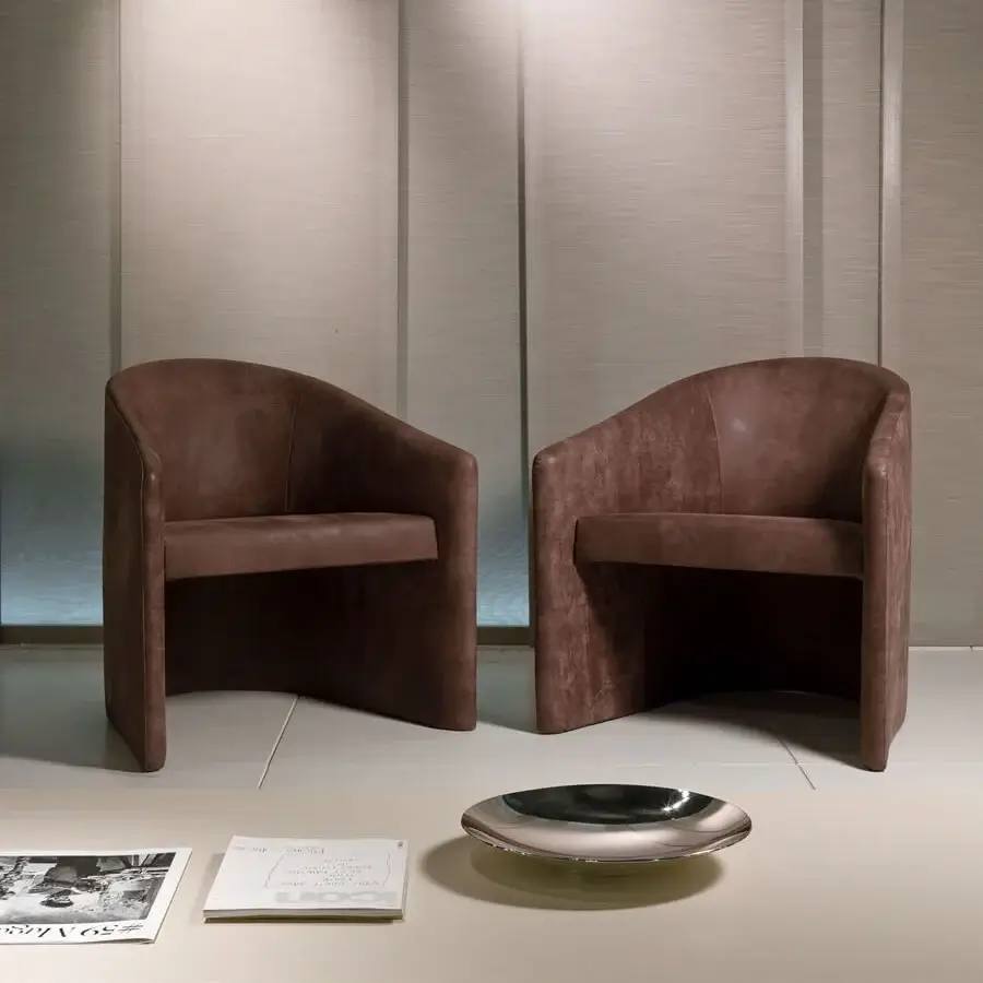 Superior 4 Mariani Manta lounge chair with enveloping lines built in matte brown upholstered polyurethane mould