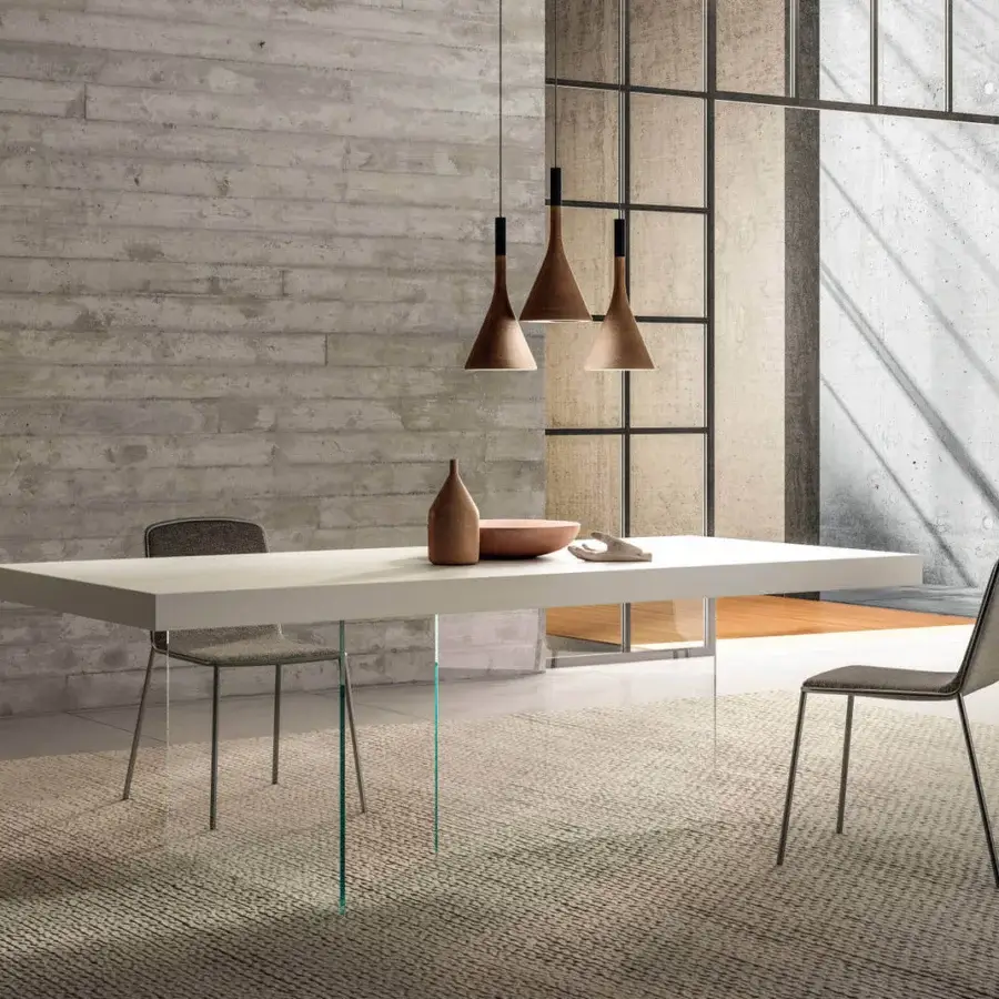 Elegant Lago Air table with a floating laminate top and clear tempered-glass legs exhibiting minimalist design