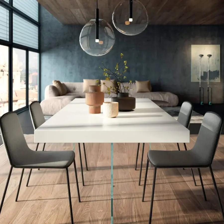 Distinguished Lago Air table with a white lacquered top and transparent tempered-glass legs, surrounded by gray textile chairs with black metal legs