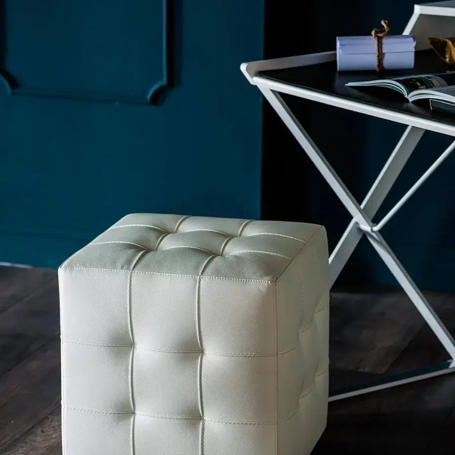 Distinguished Cattelan Italia Bob ottoman with tufted detailing in smooth white synthetic leather and wheeled base