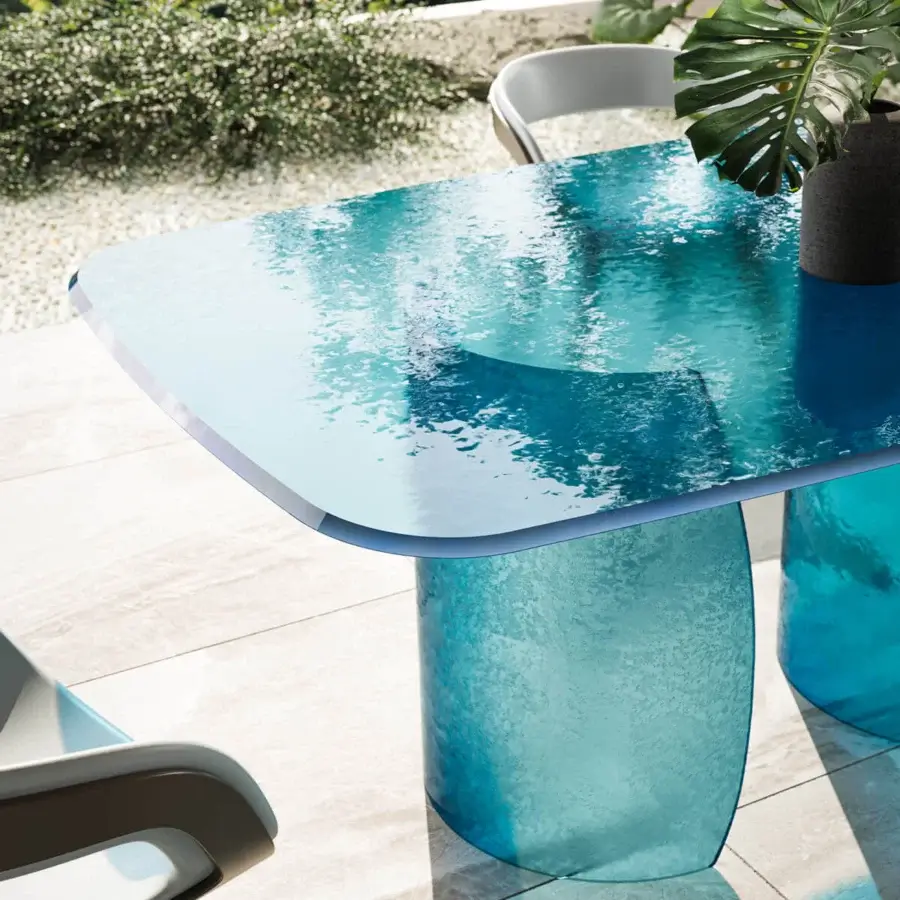 Captivating Reflex Petalo Acqua table with textured Acqua glass top and cylindrical bases in gradient light to deep blue hues