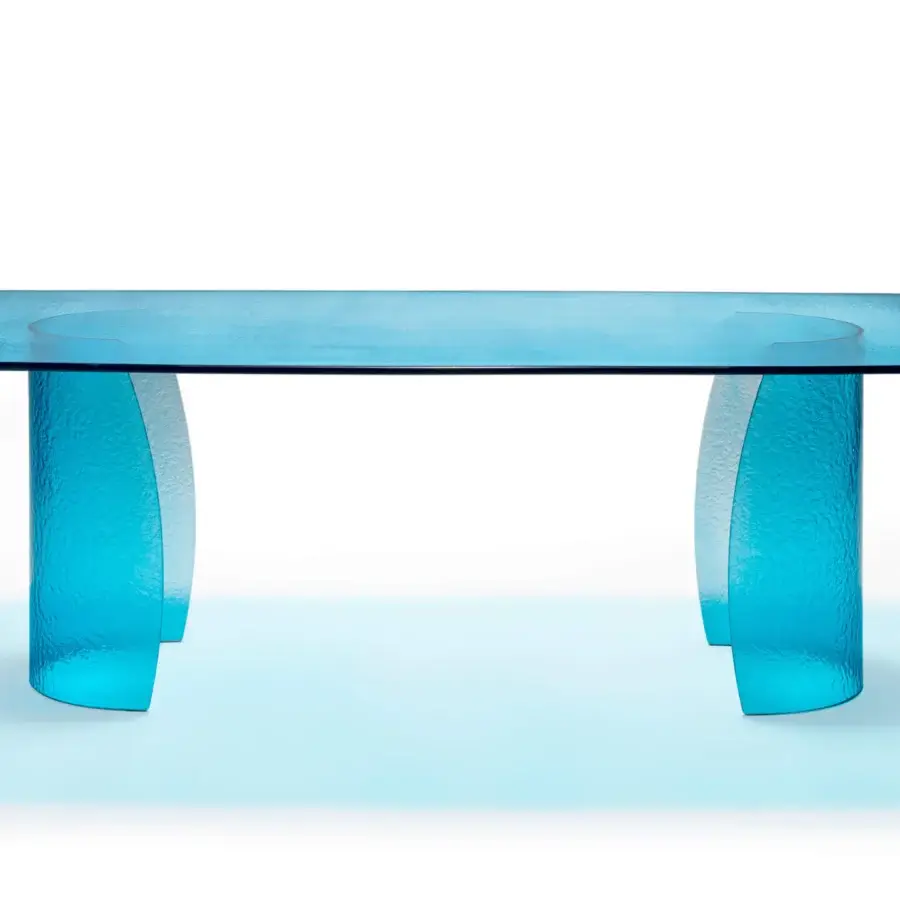 Distinguished Reflex Petalo Acqua table with rounded rectangular top and curved bases crafted from Acqua glass in a monochromatic light blue hue