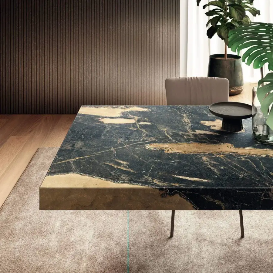 Distinguished Lago Air table with monolithic XGlass tabletop exhibiting dark marble-like finish and nearly invisible tempered glass legs
