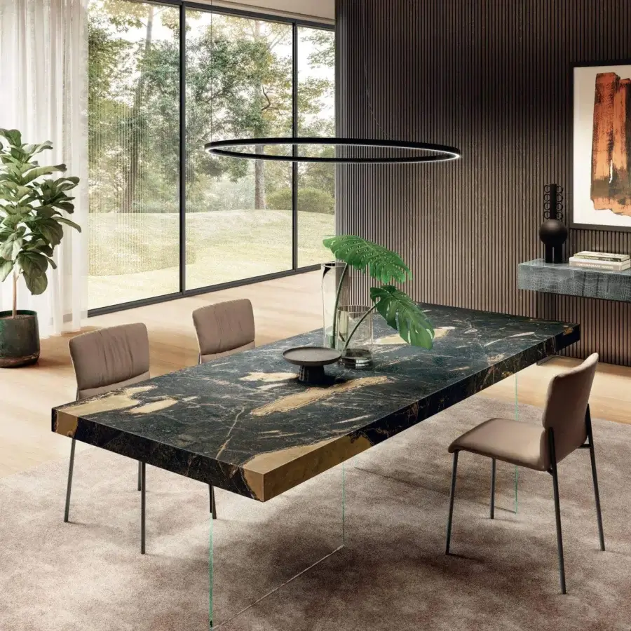 Exceptional Lago Air table with monolithic XGlass tabletop exhibiting black, gold, and brown marble-like patterns and clear tempered-glass legs