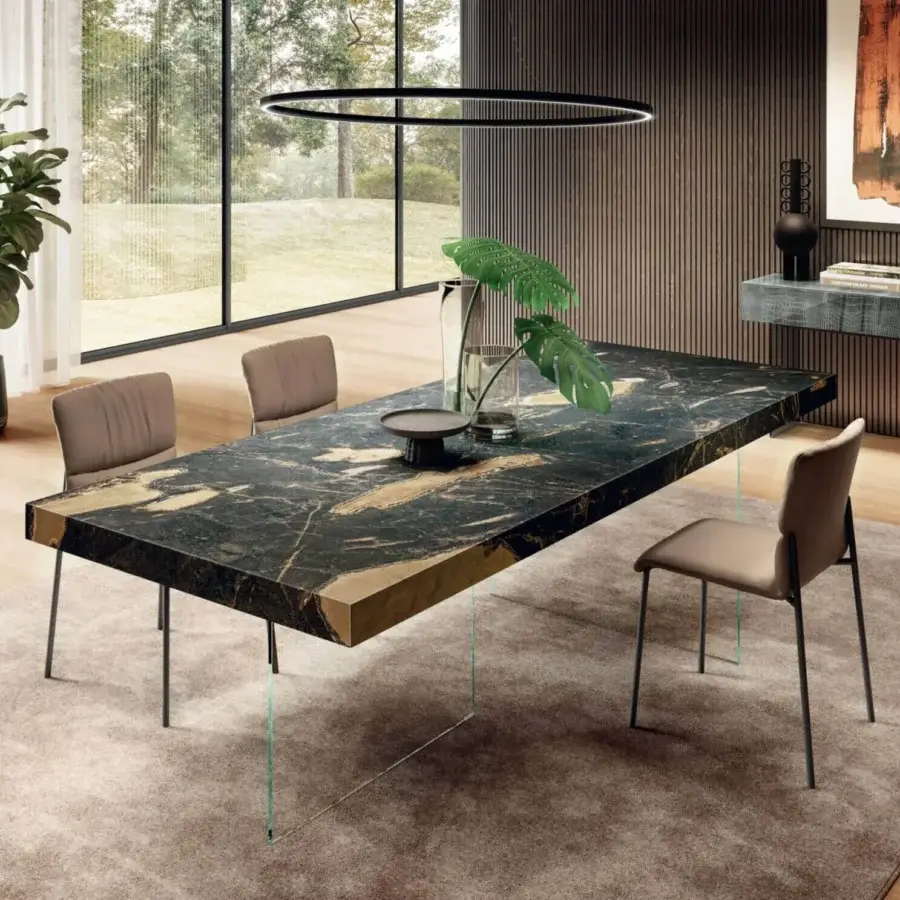 Superior Lago Air table with transparent tempered-glass supports and monolithic XGlass tabletop exhibiting rich black and gold tones