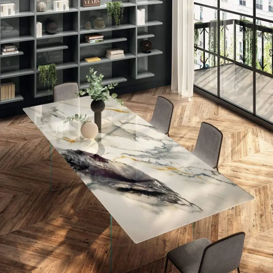 Elegant Lago Air Slim table with glossy white glass top displaying grey, gold and black marble patterns and tempered-glass supports