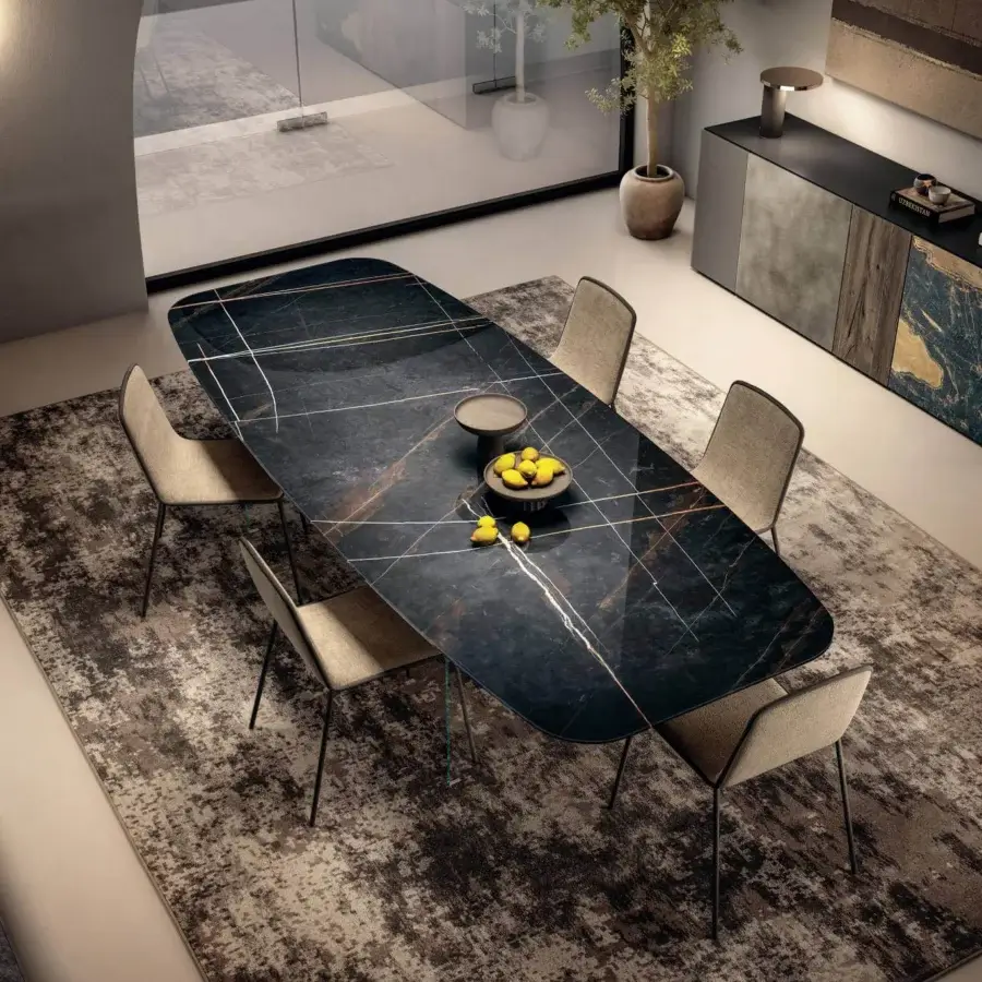 Elegant Lago Air Slim table with glossy dark tabletop exhibiting marbled patterns in black, gold, and white with tempered-glass supports