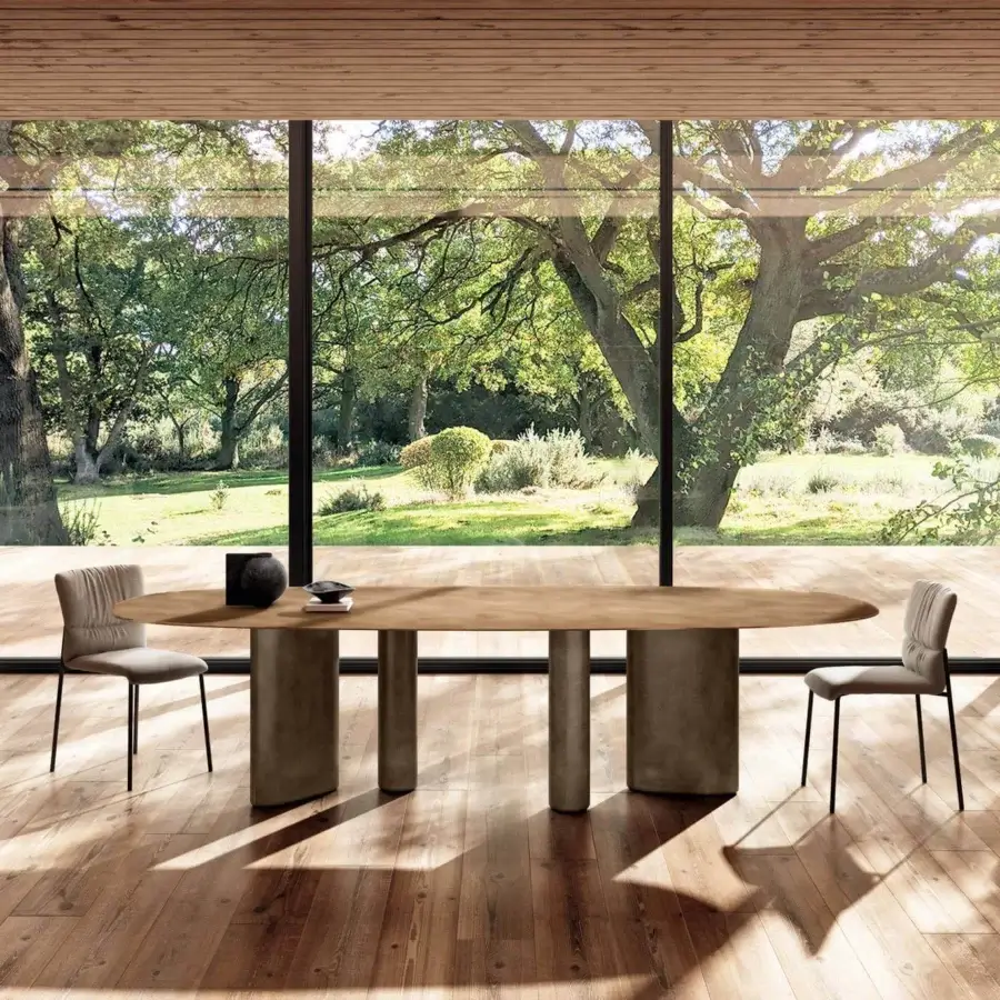 Distinguished Lago Hoa table crafted in Italy with an oval light wood appearance and dark matte cylindrical base