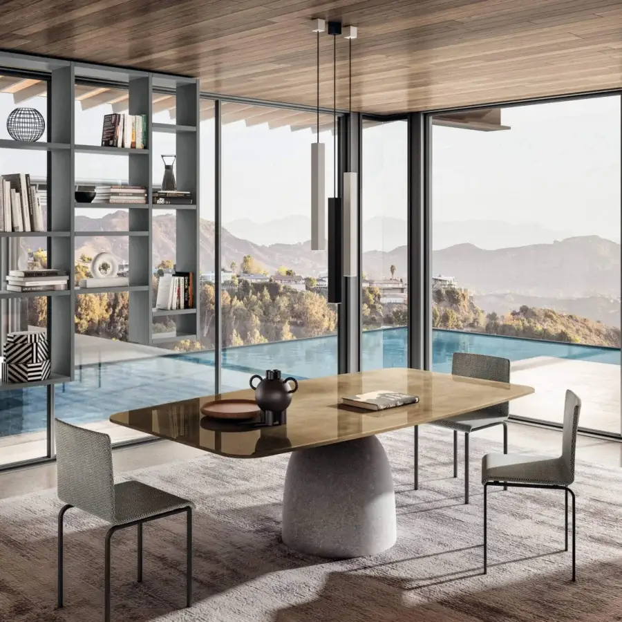 Exceptional Lago Janeiro table with concrete base and amber-toned glass tabletop, built with dark metal legs and glossy finish