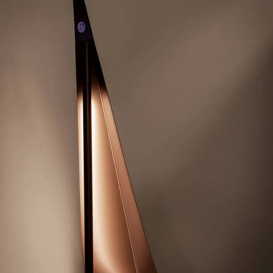 Distinguished Bizzotto Italia Noshi floor lamp crafted in recyclable aluminum with a copper-toned, sail-shaped shade for adjustable light