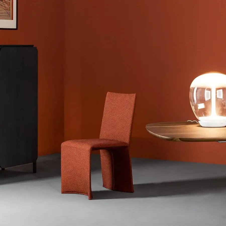 Distinguished Bonaldo Ketch chair inspired by sailboats with textured matte orange fabric and continuous loop base