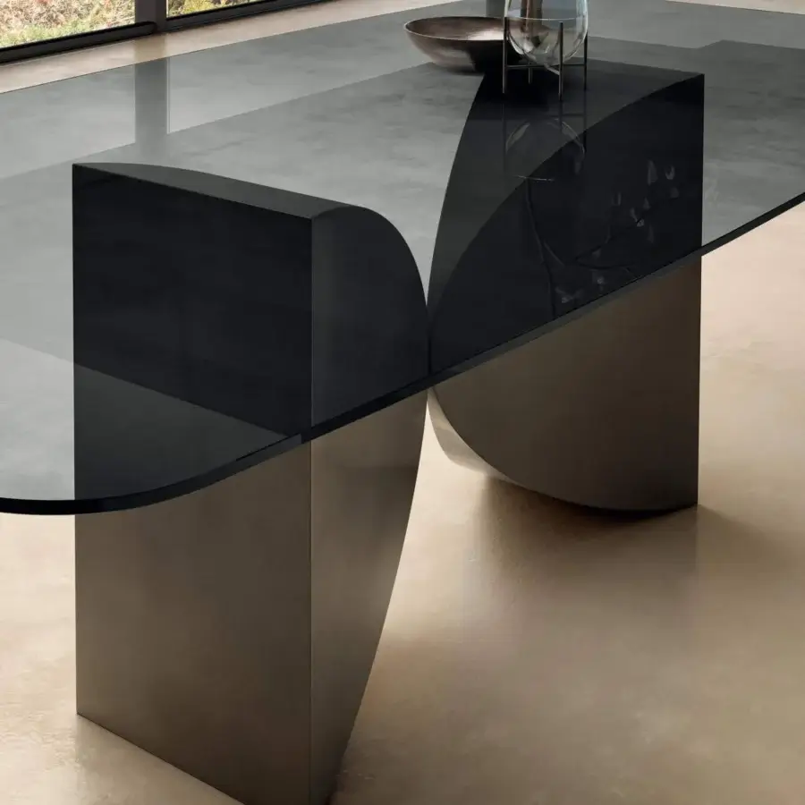 Exceptional Lago Meet table with smoky matte grey glass top and sculptural bronze-like metallic base crafted in Italy