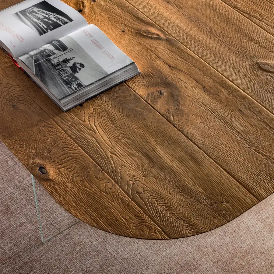 Harmonious Lago P&J table with ultra-thin Wildwood top, rounded corners, and rustic finish in warm brown tones with glass support