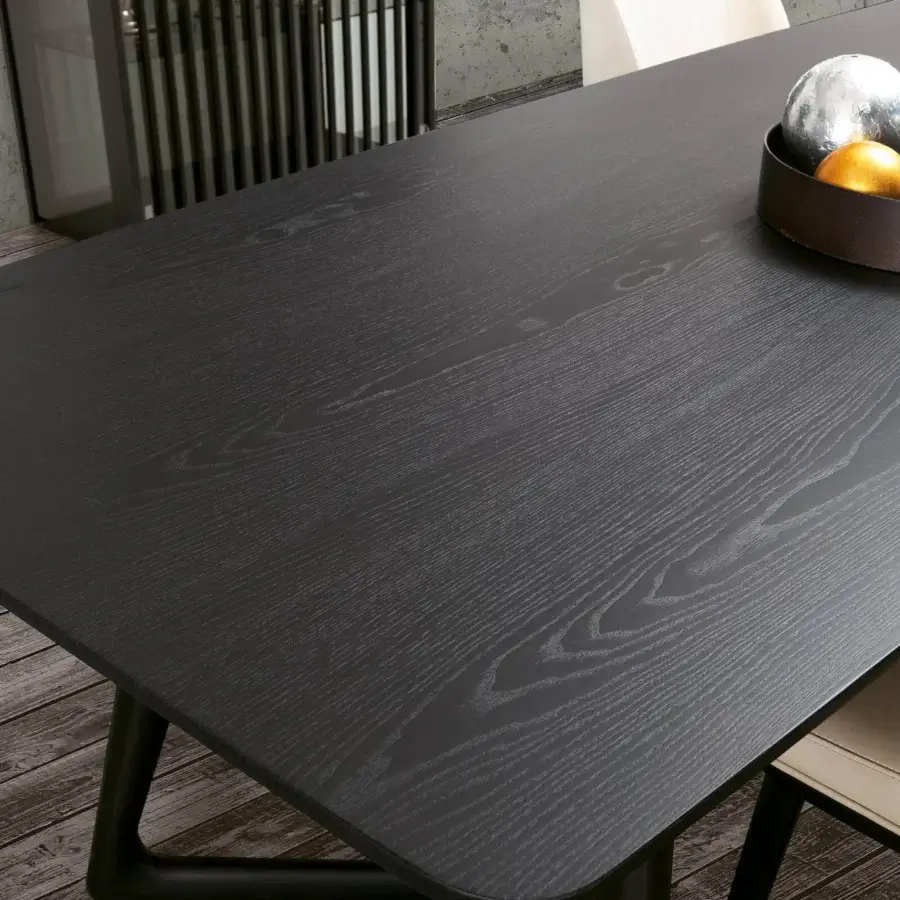 Distinguished Pacini & Cappellini Cover table with a barrel top in veneered ash wood and inclined solid ash wood base with uniform dark finish