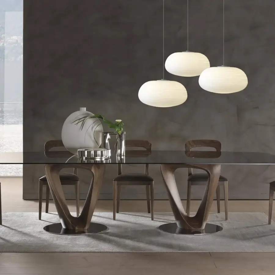 Refined Pacini & Cappellini Gaya chair with solid Canaletto walnut structure and arched backrest in warm medium-brown tones