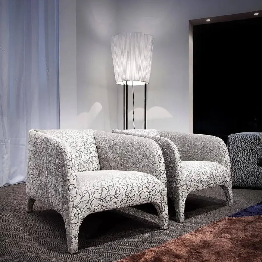 Distinguished Erba Opale lounge chair crafted with solid wood and multilayer wood, upholstered in textured grey and white polyester fibre