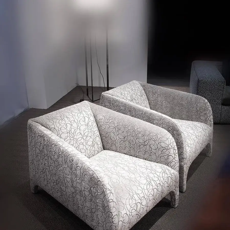 Exceptional Erba Opale lounge chair with solid wood frame upholstered in light gray textile exhibiting swirling darker gray lines