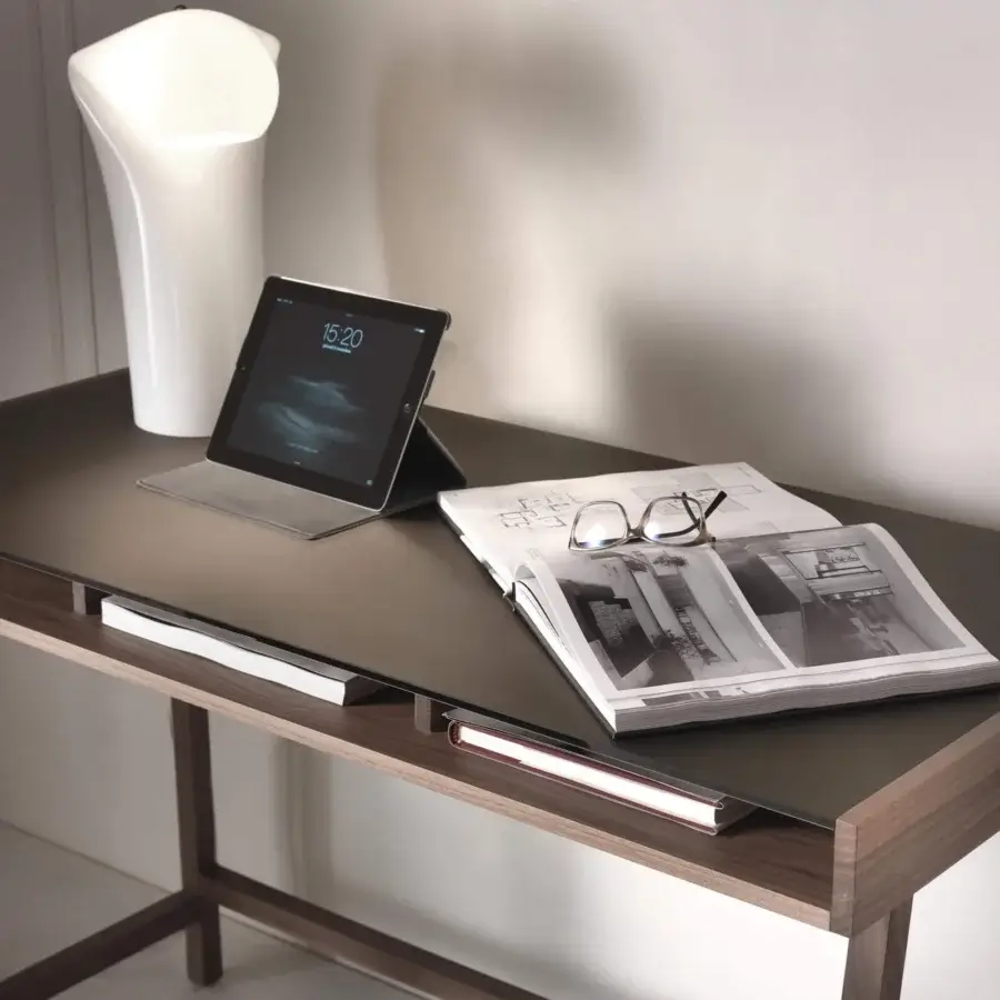 Distinguished Pacini & Cappellini Abaco desk with Canaletto walnut frame and dark tabletop offering a medium-brown wood finish