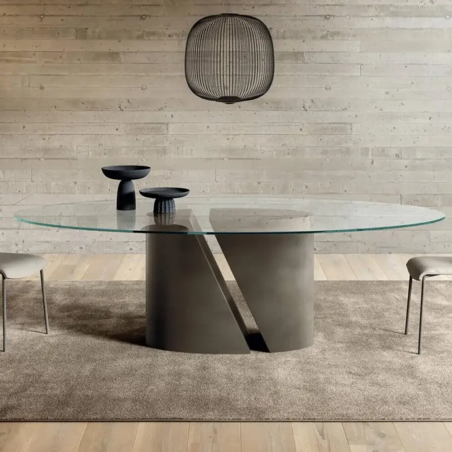 Architectural Lago Wadi elliptical table with transparent glass and matte gray concrete-like base finish