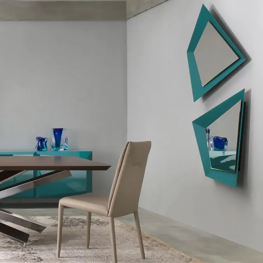 Superior Reflex Quartz mirror with angular lines and a turquoise lacquered extra clear glass frame