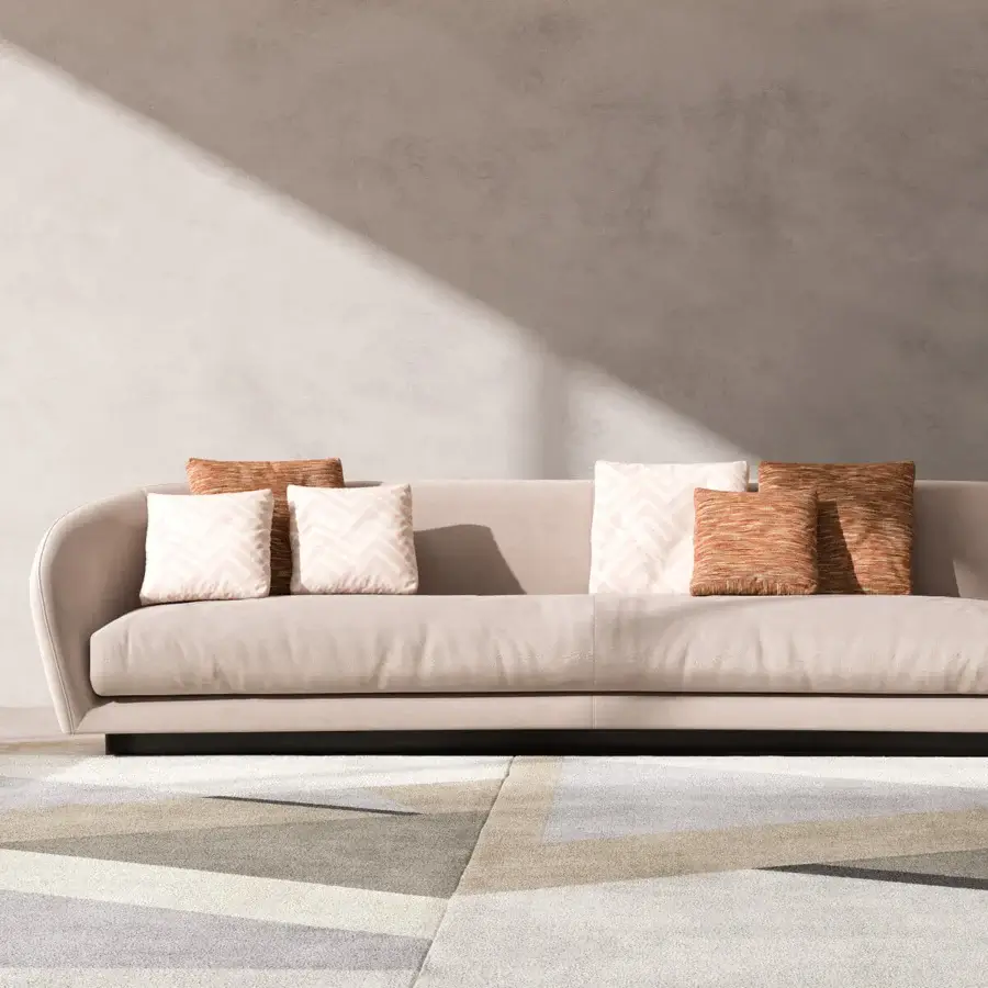Elegant CPRN Homood Downtown sofa upholstered in light beige textile with a smooth finish and rust chevron cushions