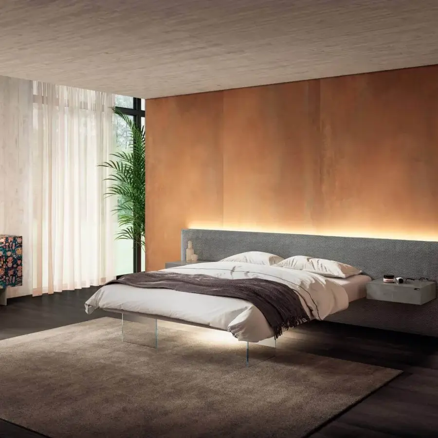 Exceptional Lago Air bed with textured gray textile upholstery, extra-clear tempered glass supports and integrated bedside lighting