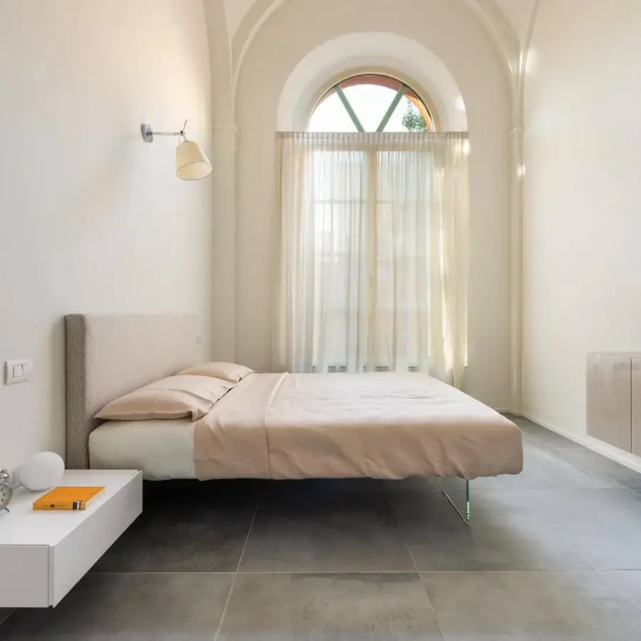 Distinguished Lago Air bed with neutral textile headboard and extra-clear tempered glass supports crafted in Italy