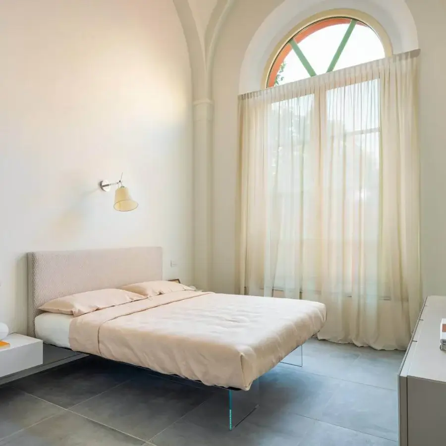 Exceptional Lago Air bed with light beige textile headboard and extra-clear tempered glass, crafted in Italy