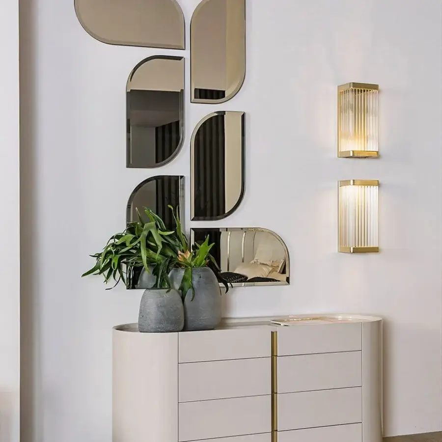 Distinguished Bizzotto Italia Ikat wall lamp with vertically fluted glass encased in glossy light gold-toned metal framing