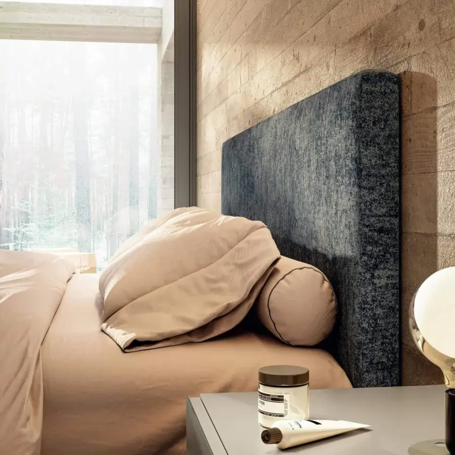 Superior Lago Fluttua bed crafted in Italy with a mottled dark blue upholstered headboard and innovative HPL base