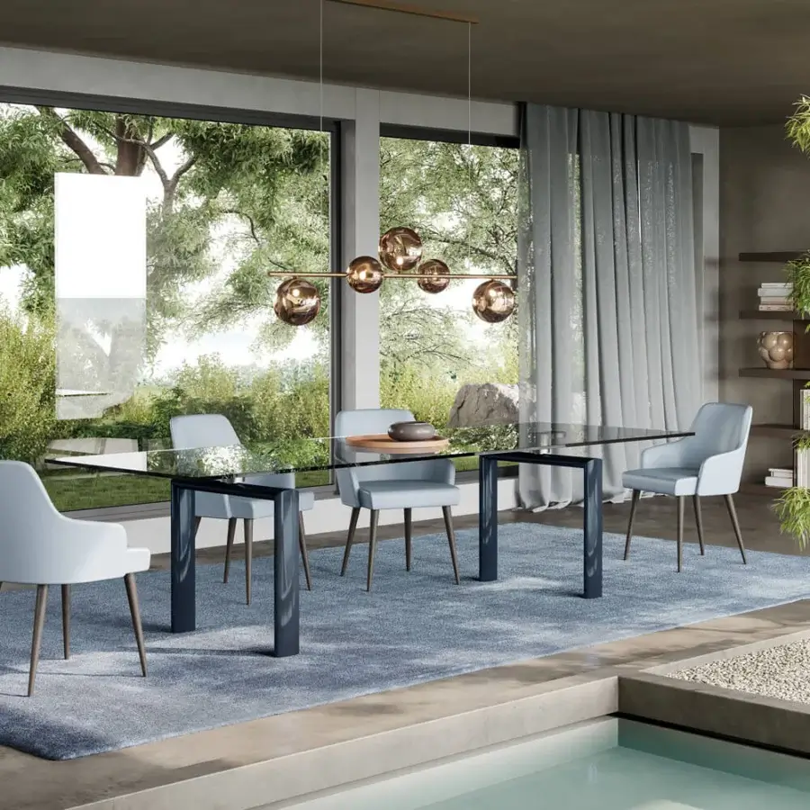 Superior Reflex Policleto table, a sleek table with transparent tempered glass and glossy dark-finished oval metal legs