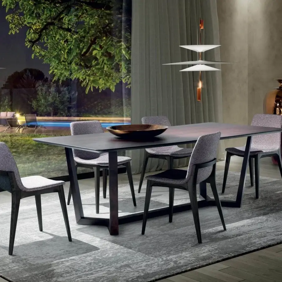 Distinguished Pacini & Cappellini Aliante table with dark wood veneered ash top and geometric cutouts in a solid ash base