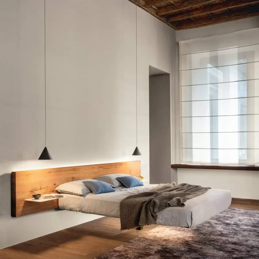 Exceptional Lago Fluttua bed with a wooden headboard and light fabric-covered mattress exhibiting integrated illumination