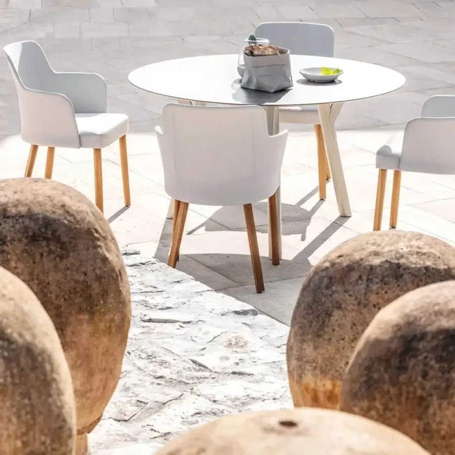 Distinguished Varaschin Emma armchair with powder-coated aluminum structure and light gray waterproof fabric complemented by natural wood legs