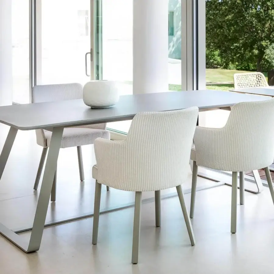 Elegant Varaschin Emma armchair with powder-coated aluminum and light vertically striped waterproof fabric upholstery