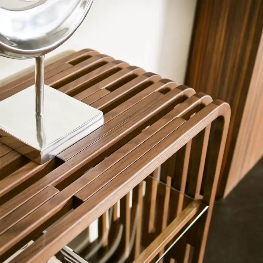 Distinguished Pacini & Cappellini Millerighe console crafted in medium brown solid ash with a clear glass shelf and curved block board finish