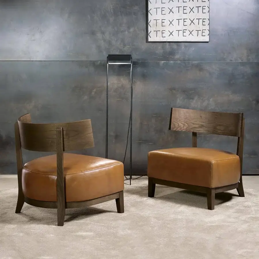 Sophisticated Pacini & Cappellini Kandy lounge chair with light-brown upholstered maxi seat and curved solid ash structure
