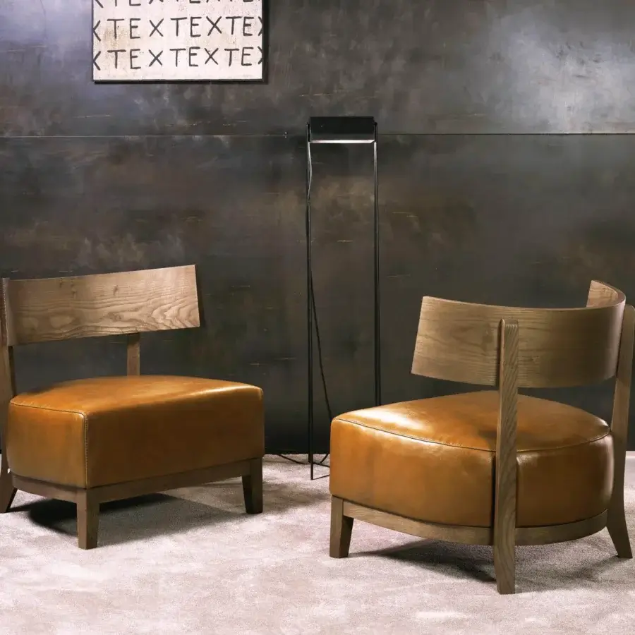 Exceptional Pacini & Cappellini Kandy lounge chair with comfortable tan leather upholstery and curved solid ash structure
