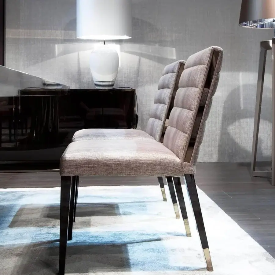 Elegant Costantini Pietro Aston chair in light brownish-gray textile with dark finished beech wood legs and subtle metal accents