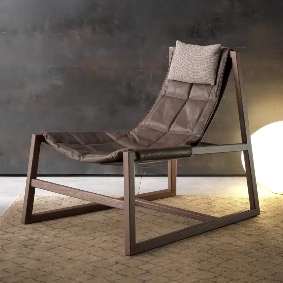 Sophisticated Pacini & Cappellini relax lounge chair with quilted brown leather and woven beige headrest in matte brown wood