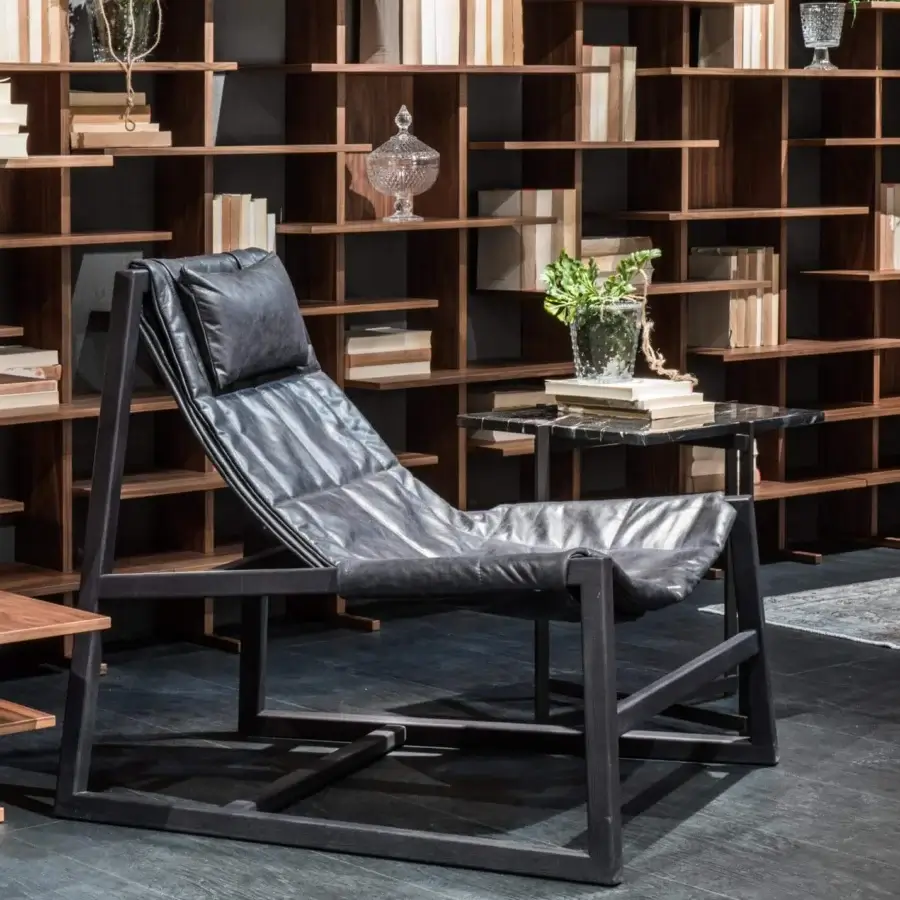 Exceptional Pacini & Cappellini relax lounge chair with matte leather seat and dark finished solid wood structure