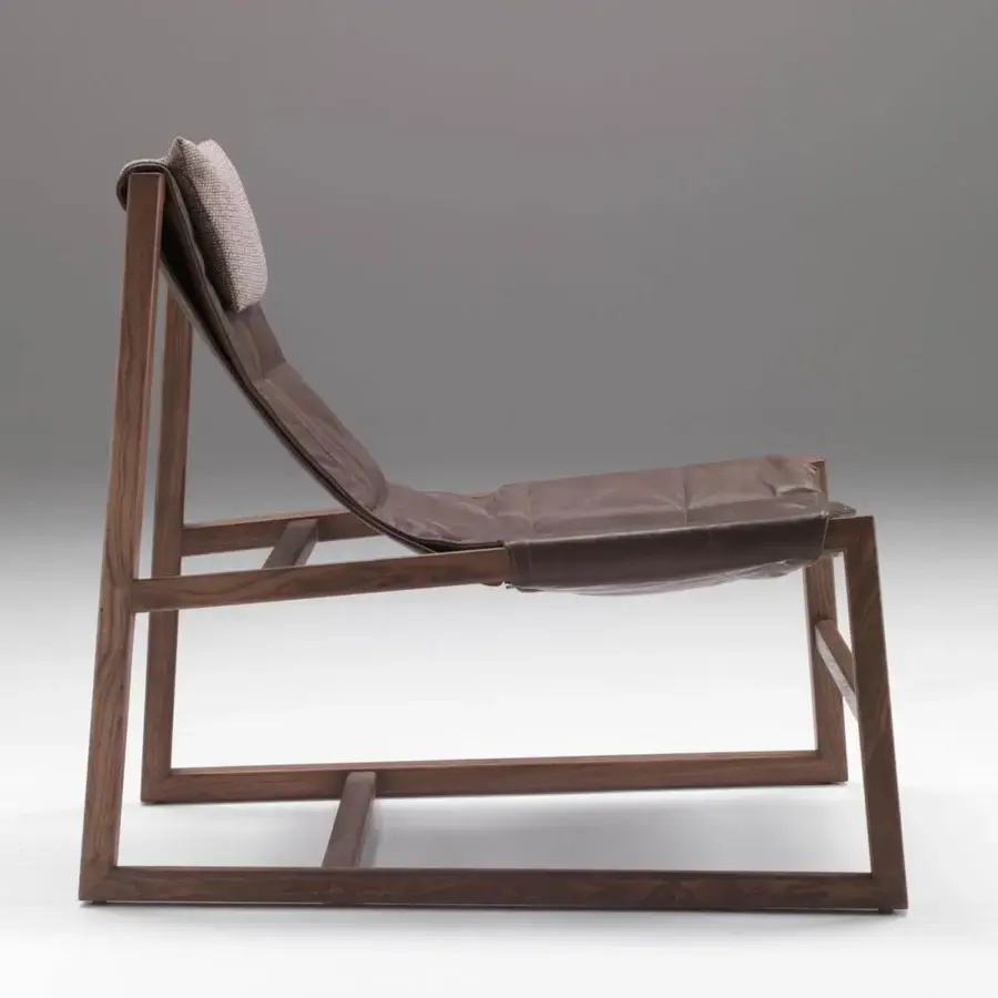 Elegant Pacini & Cappellini relax lounge chair with dark brown wood frame and rich brown leather padding
