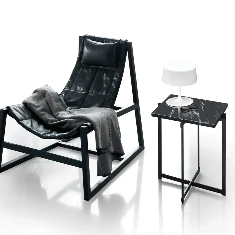 Elegant Pacini & Cappellini relax lounge chair with dark quilted textile upholstery and a striking wood frame