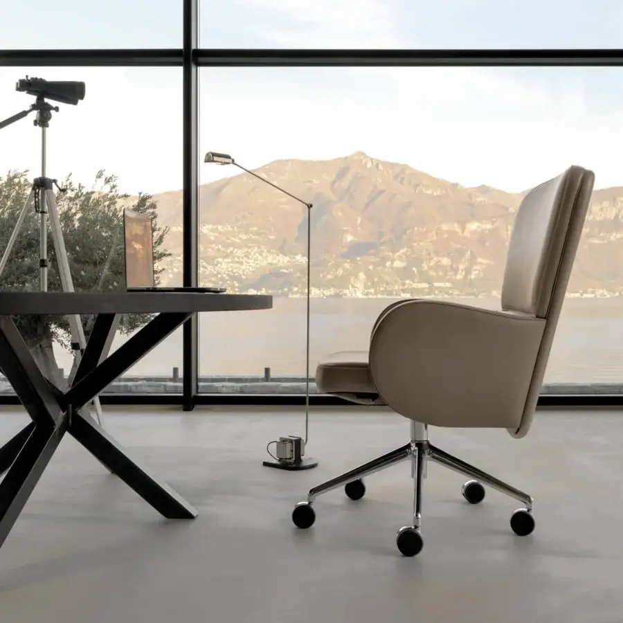 Superior Mascheroni Brera armchair crafted in light beige synthetic material or leatherette with rotating castors and metal base
