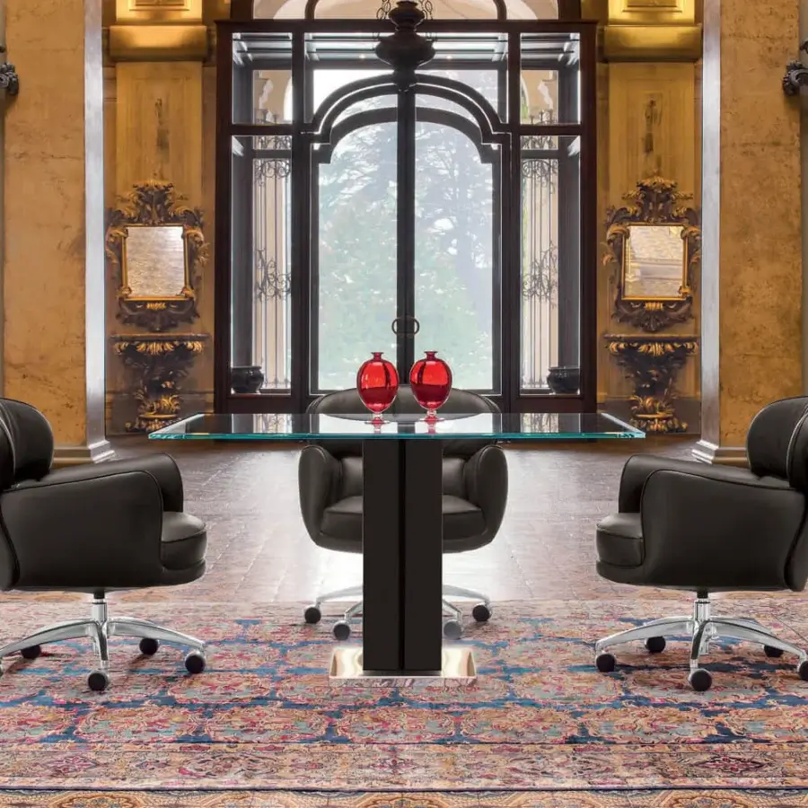 Distinguished Mascheroni Utopias armchair built in dark leather with a birch shaped wooden structure and glossy metal base