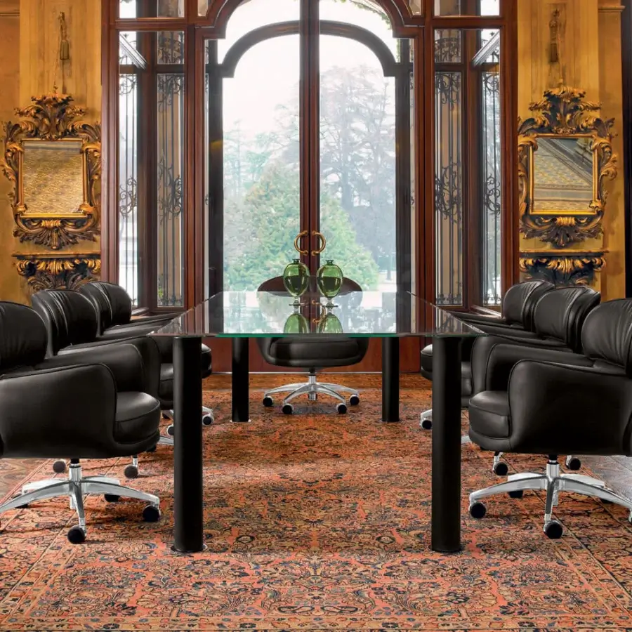 Superior Mascheroni Utopias armchair built in dark leather with a curved silhouette and five-star steel base