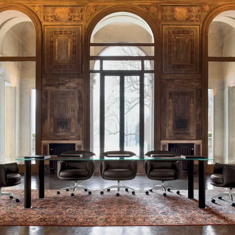 Elegant Mascheroni Utopias armchair built in dark supple leather with a curved backrest and steel base
