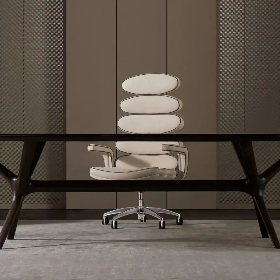 Distinguished Mascheroni Airone armchair built in Italy with light cream textile upholstery and shiny swivel base