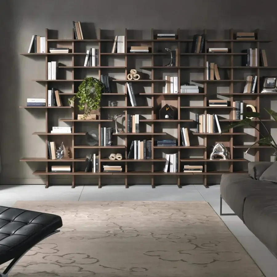 Exceptional Pacini & Cappellini bookcase crafted in medium brown wood with an asymmetrical alternating shelf design and matte finish
